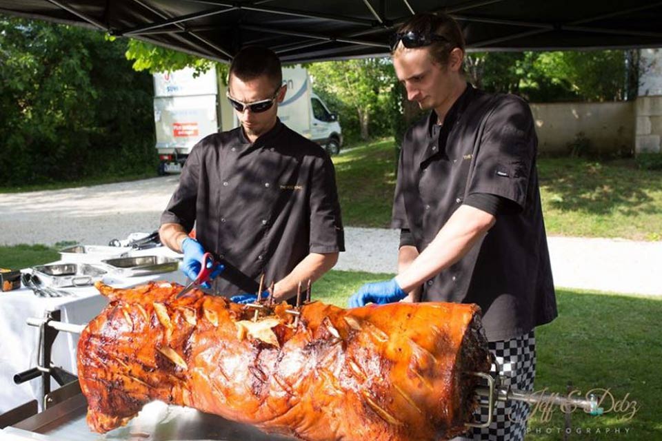 Catered pig roast outlet near me